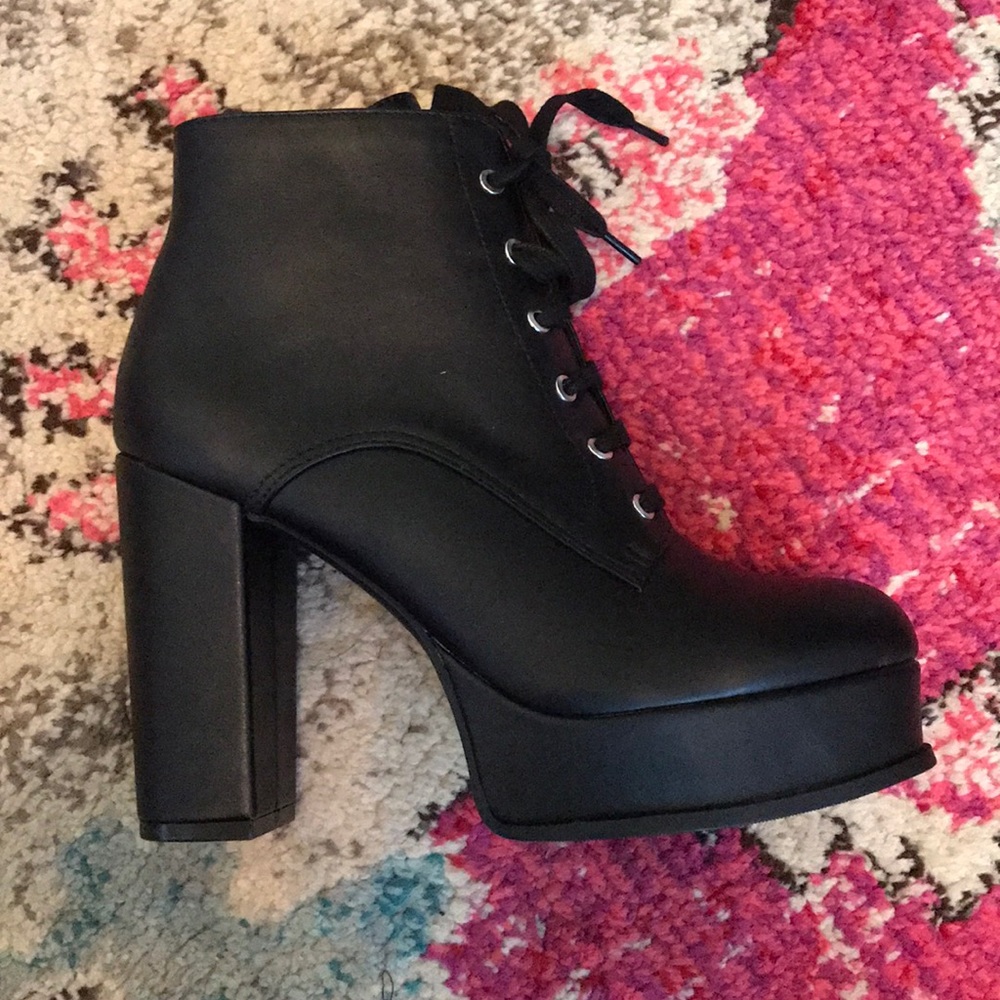 Black leather platform booties.